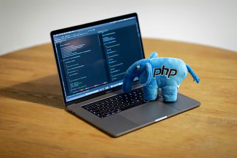 An PHP-Elephant on a Laptop. Image from Ben Griffiths via unsplash.com
